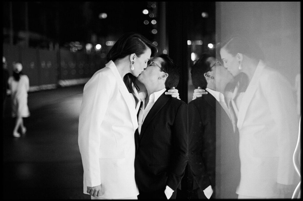 Brides kissing at romantic New York City wedding.