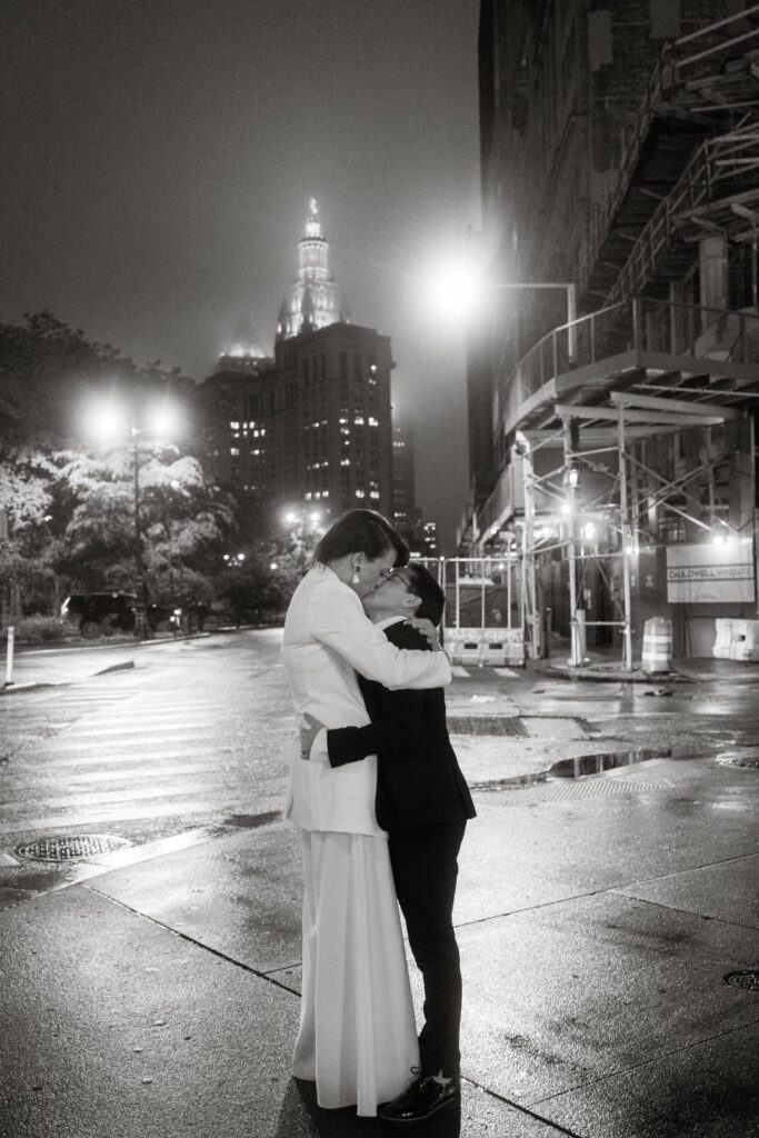 Brides kissing at romantic NYC wedding.