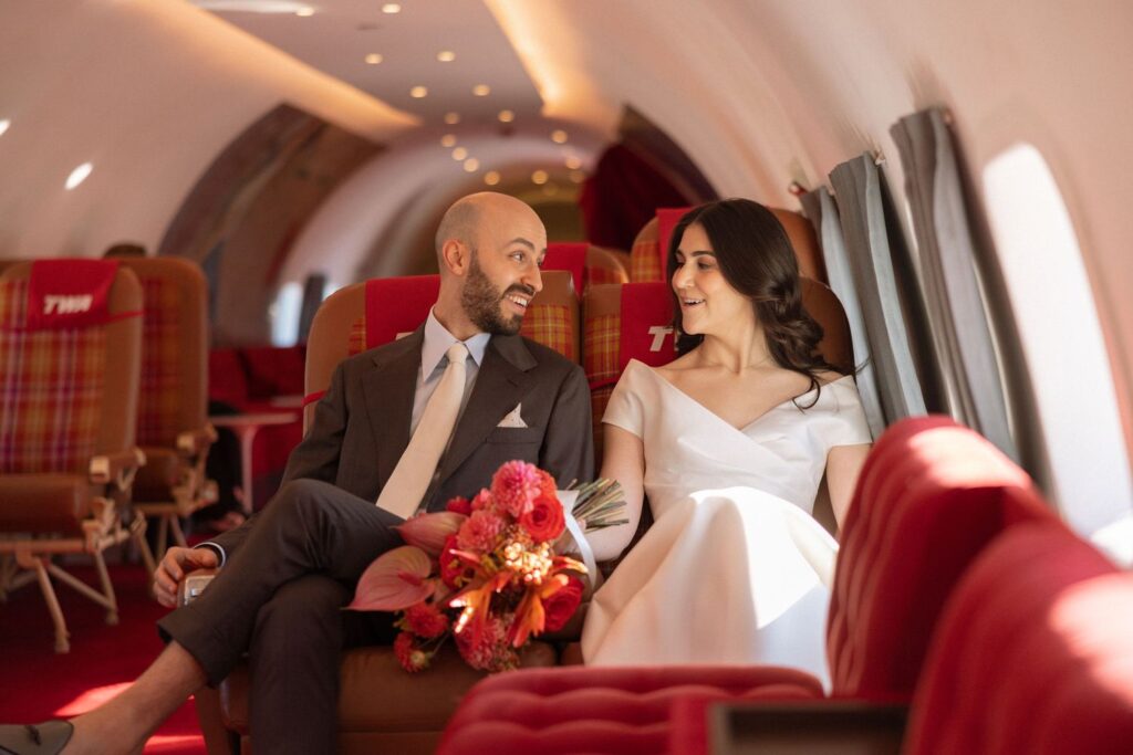 Bride and groom on private jet at JFK Airport.