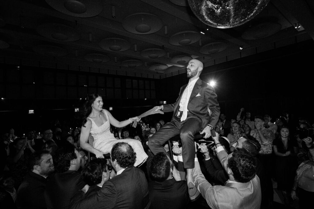 The hora dance at jewish wedding at TWA Hotel.
